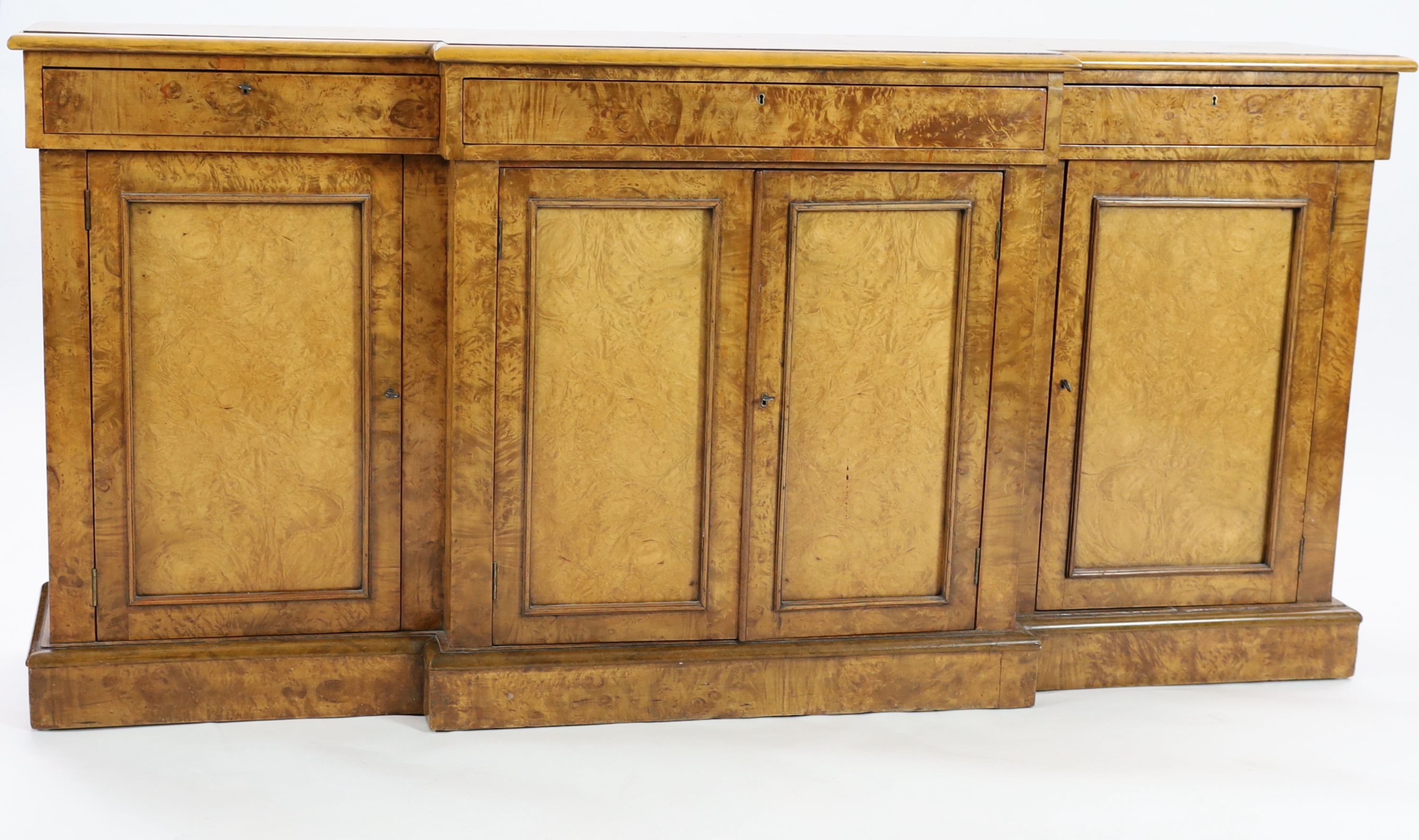 A Victorian walnut breakfront dwarf bookcase, W.195cm D.44cm H.95cm